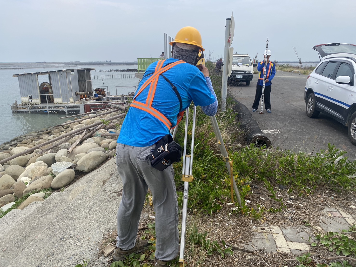 Photo 1. Illustrative photo of leveling survey for the seawall area review & revision survey.